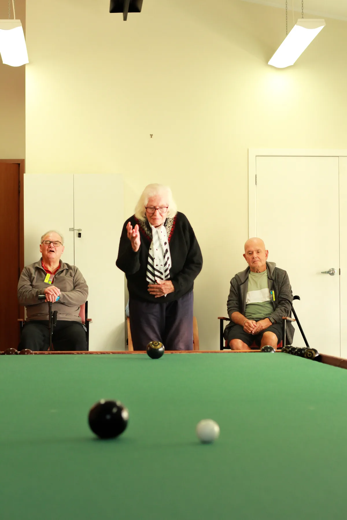 Residents playing a game of indoor bowls together